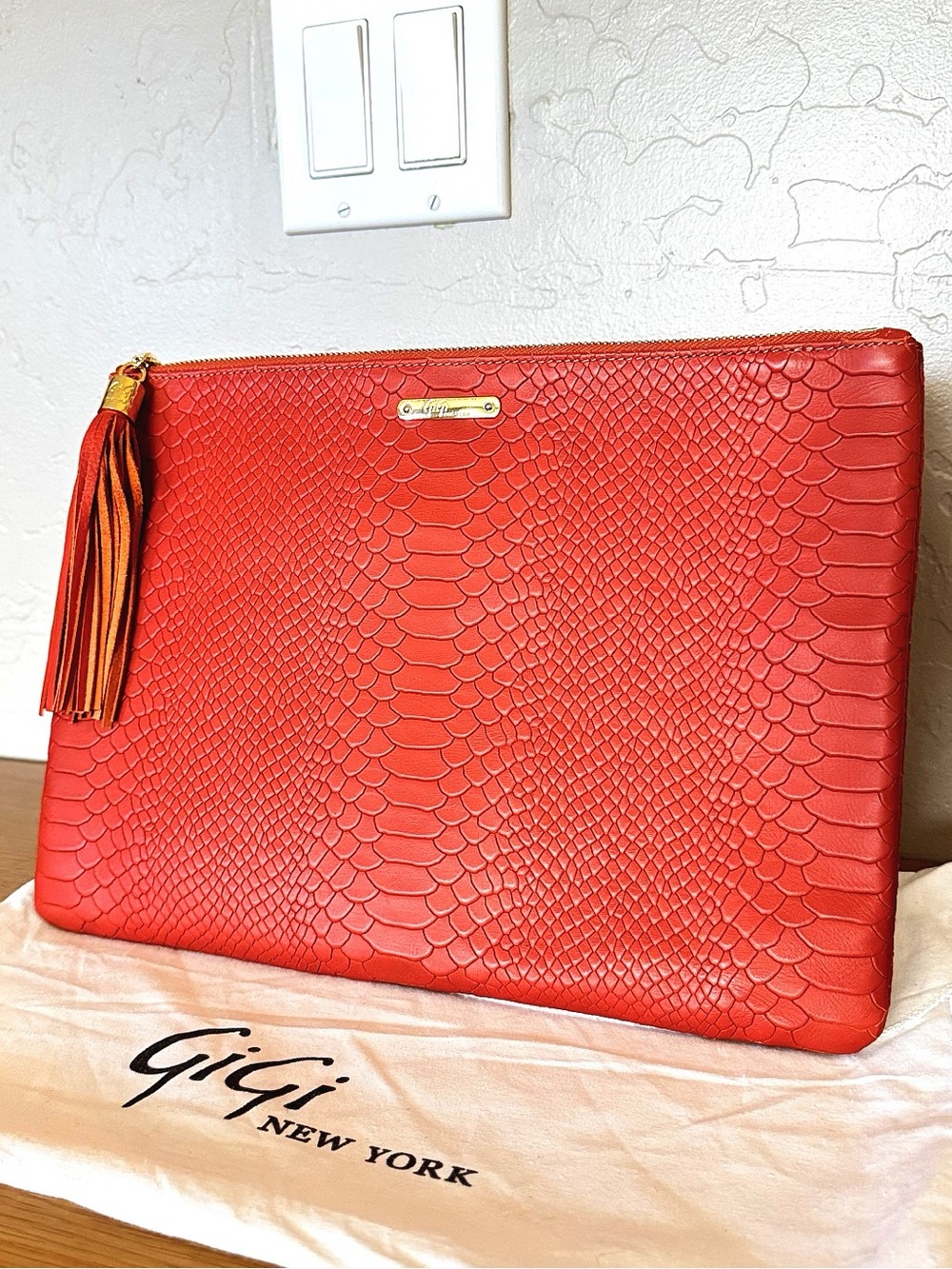 Gigi New York reptile orange leather Uber clutch